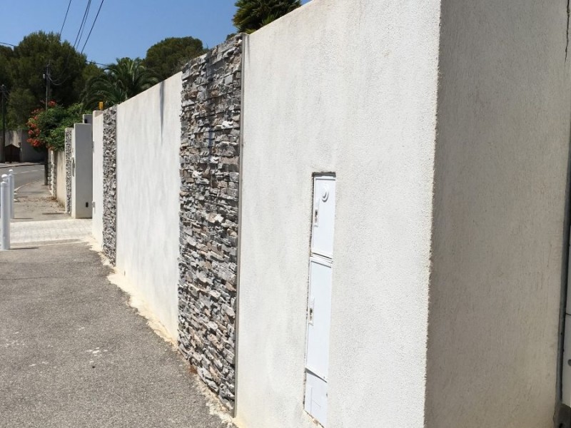 Construction de mur de clôture, mur de soutènement à Palaja